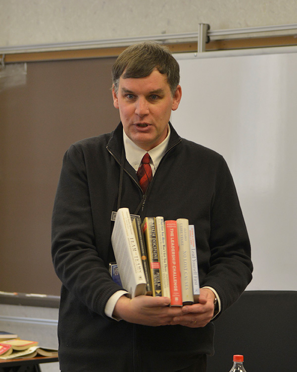 Professor Andersen carrying books