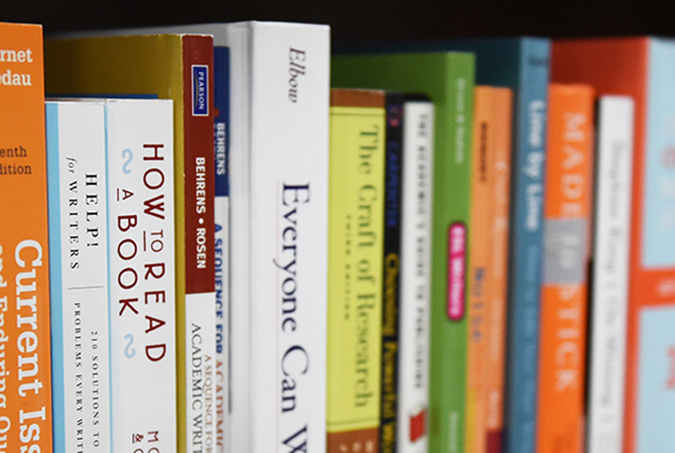 Photo of books on a shelf.
