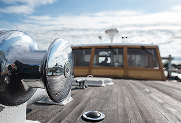 Boat with cabin in the background.