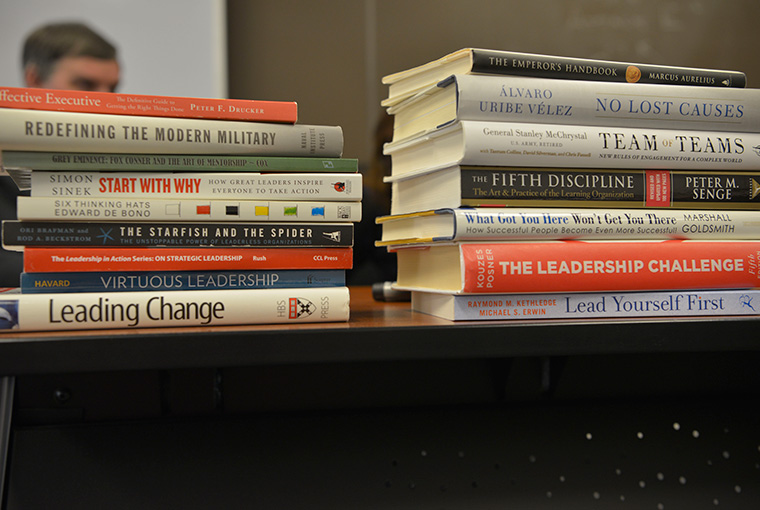 Leadership books sit on a table in the classroom of Gene Andersen, associate professor, College of Leadership and Ethics, U.S. Naval War College.