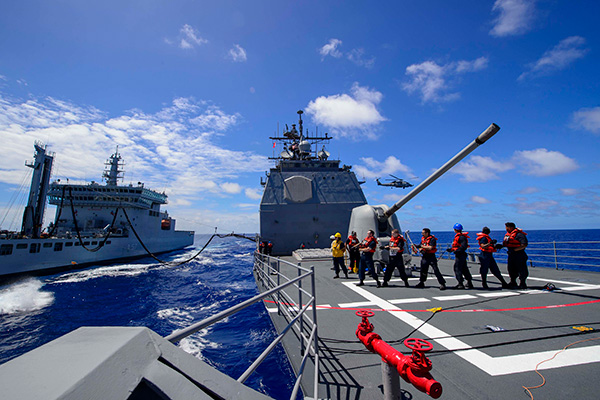 Sailors assigned to the Ticonderoga-class guided-missile cruiser USS Antietam (CG 54) conduct an underway replenishment (UNREP) training exercise with the Indian navy oiler INS Shak ti (A 57) during exercise Malabar.