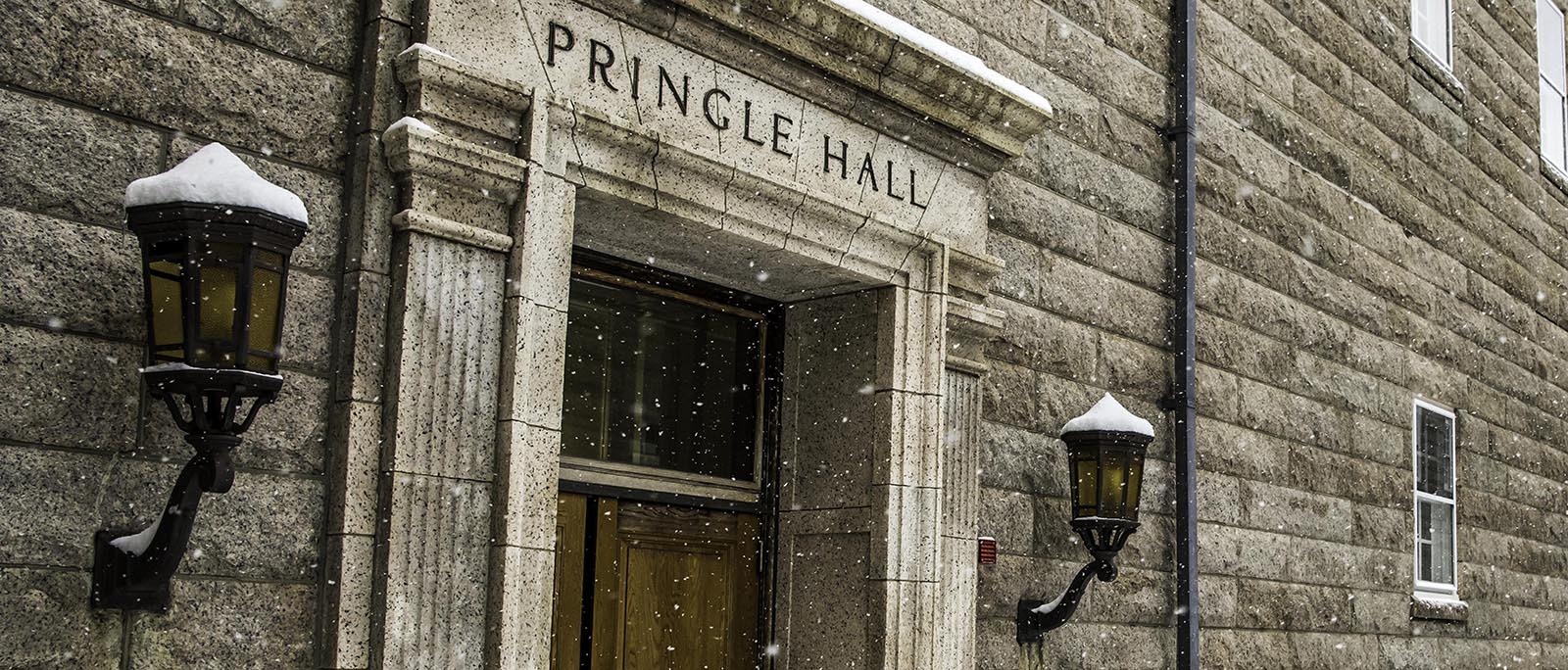 Pringle Hall side view with snow falling at U.S. Naval War College